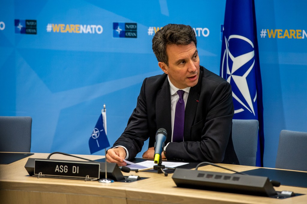 NATO defense investment official talks European security and artificial intelligence