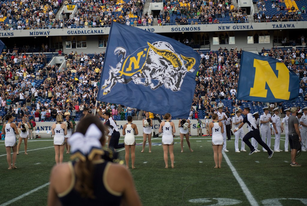 Navy runs for 569 yards in 42-32 win over Cincinnati