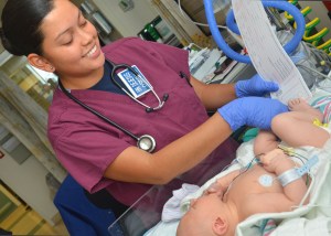 Military parents would get 12 weeks of leave to care for new children under congressional proposal