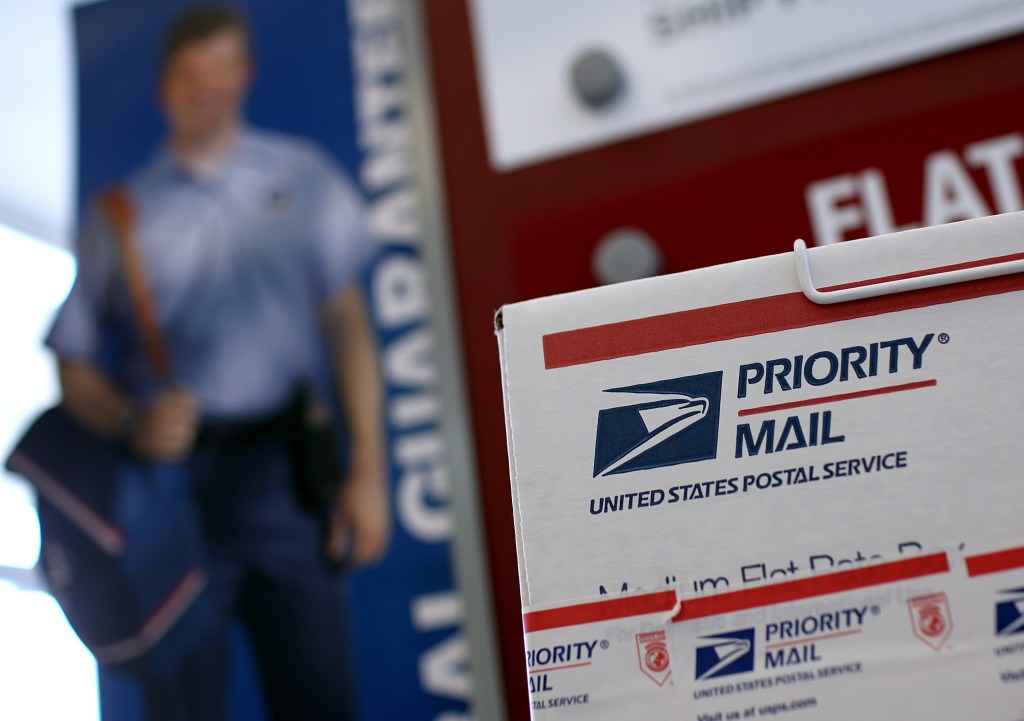 Postal workers charged with taking bribes to deliver drugs