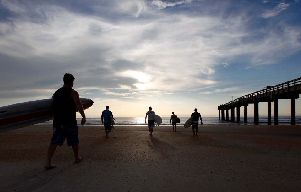 Surfing troops toss hierarchy to waves