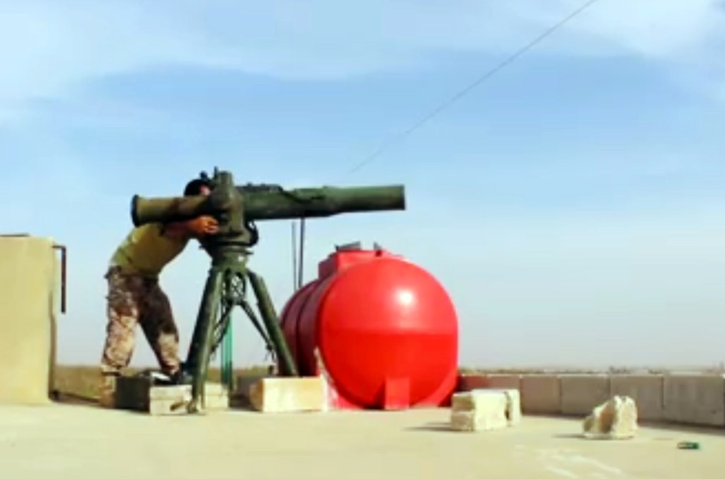 Kurdish fighters display heavy firepower in show of force to Turkey