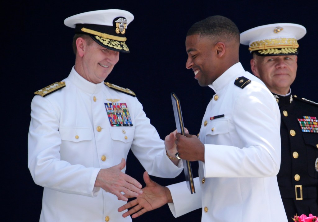 Defense secretary: Navy’s Reynolds, Swain can play in NFL