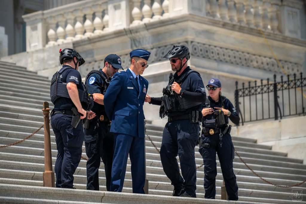 Air Force major arrested on Capitol steps during protest calling for Trump impeachment