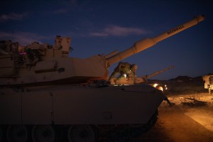 At Army experiment, experts tinker with tanks and communications kit