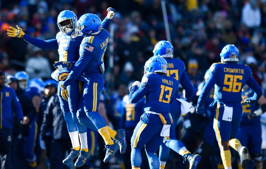 Abey’s 5 TDs help Navy beat Virginia 49-7 in Military Bowl