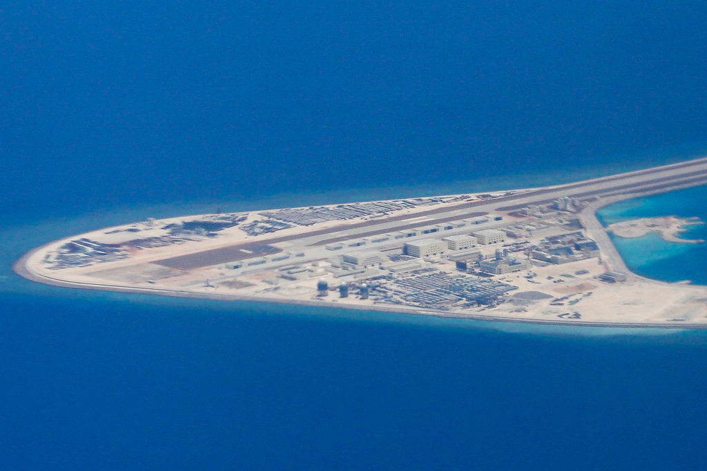 Two Navy warships sailed through disputed South China Sea waters on Monday