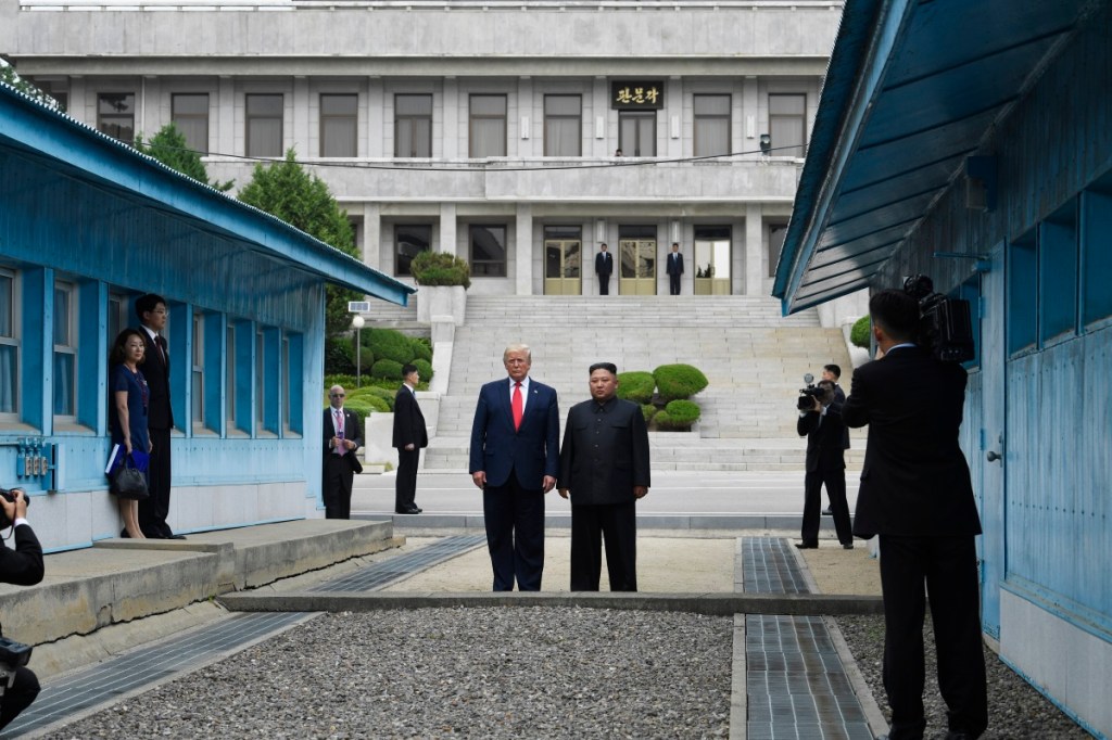 Trump, making history, steps into North Korea