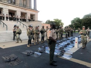 Tennessee National Guard troops lay down riot shields at protesters’ request
