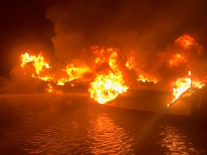 Coast Guard rescues 3 from boat blaze