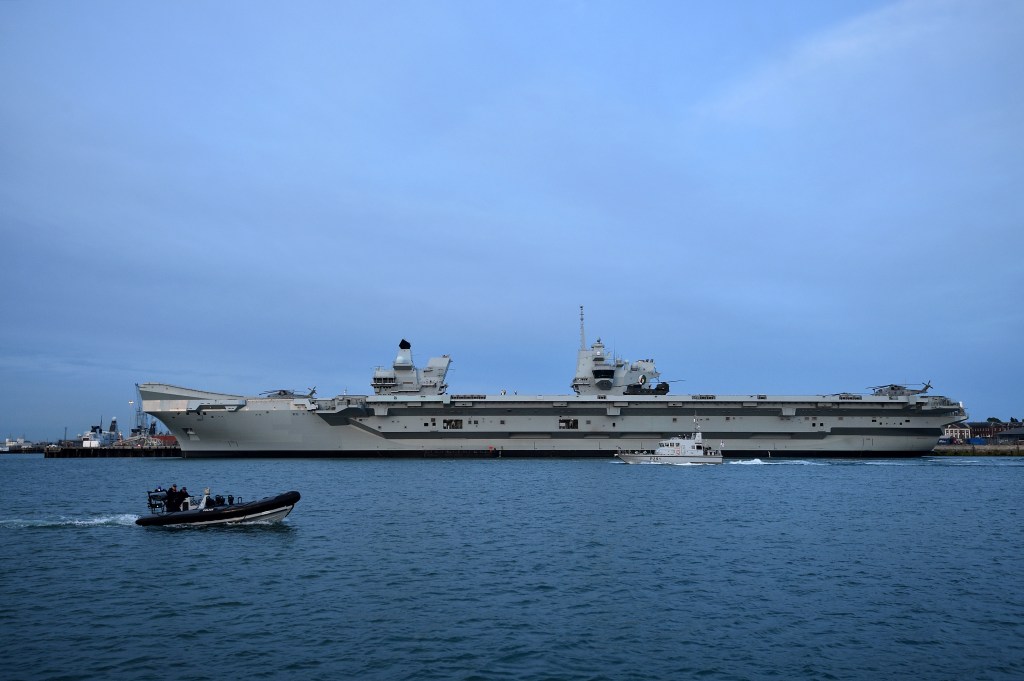 A British aircraft carrier departs Singapore amid tensions in the Pacific