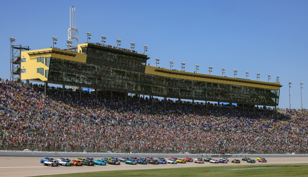 Old Glory and checkered flags — soldiers reenlist before NASCAR race