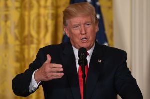 Trump to stay in Iran nuclear deal, asks Congress to revise enforcement