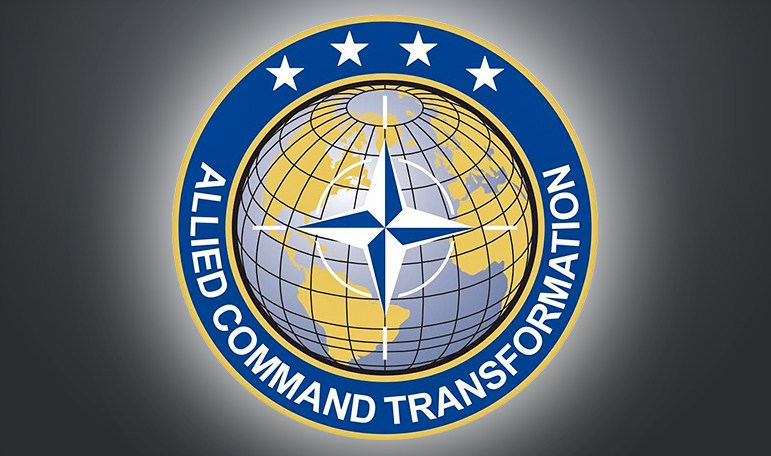 How is NATO working to increase defense spending?