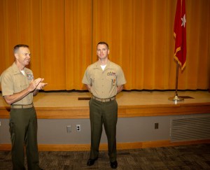 Marine intelligence officer awarded medal for rescuing unconscious man from burning vehicle