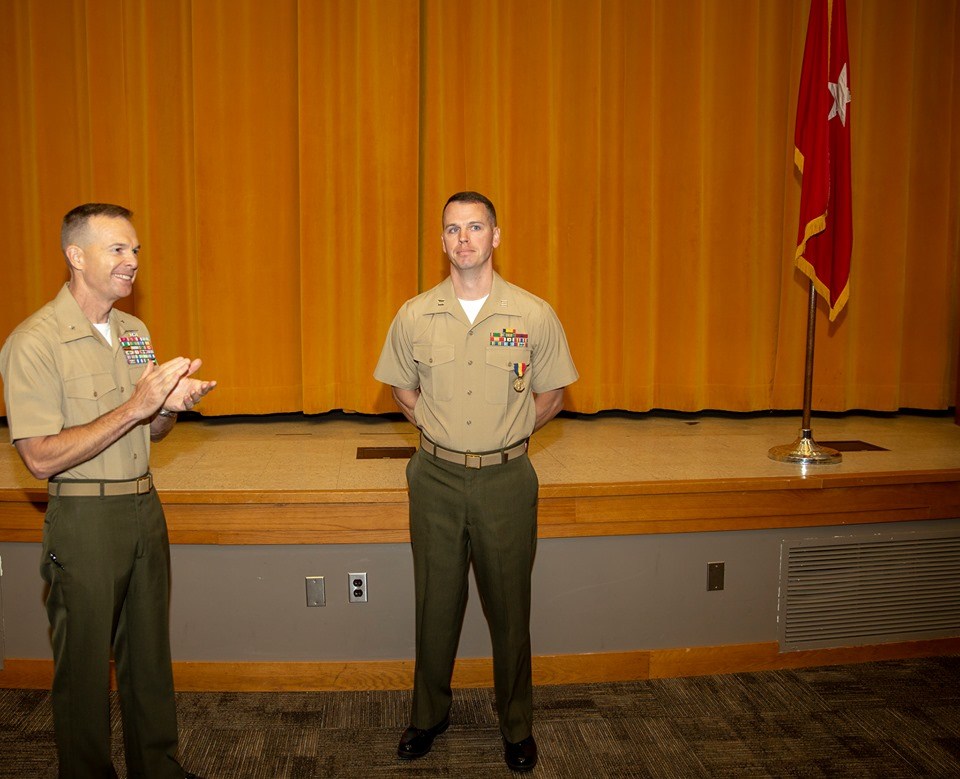 Marine intelligence officer awarded medal for rescuing unconscious man from burning vehicle