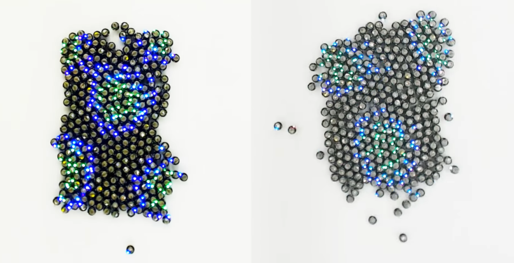 Watch a swarm of 300 robots reorganize autonomously