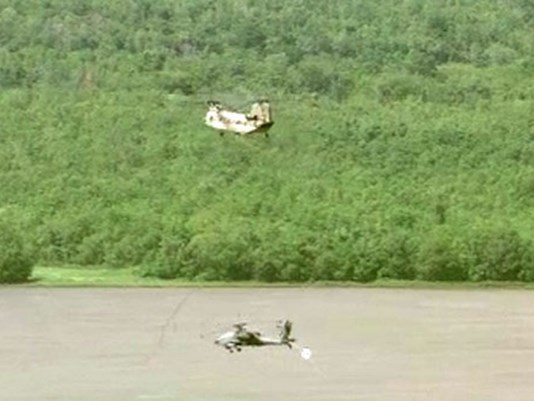 Chinook rescues stuck Apache from muddy Texas  field