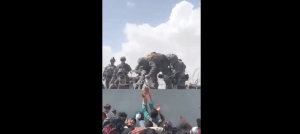 Marines in Afghanistan pull baby over barbed wire to safety