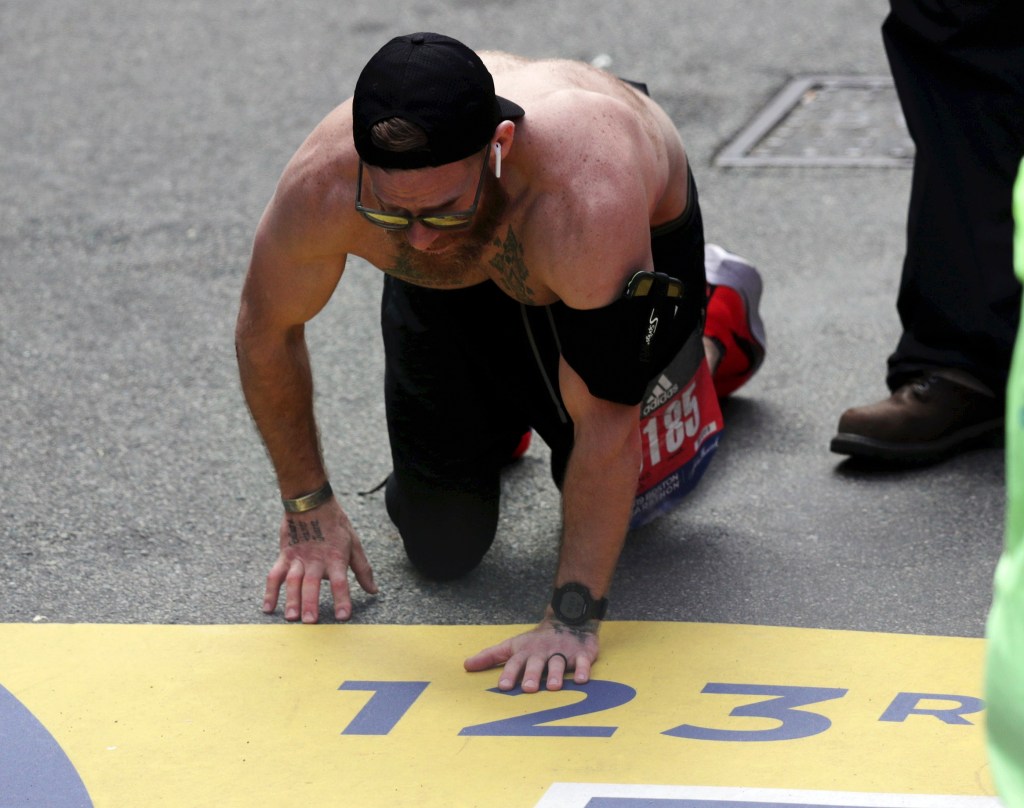 Marine vet running Boston Marathon to honor fallen comrades completes race crawling across finish line