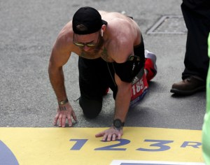 Marine vet running Boston Marathon to honor fallen comrades completes race crawling across finish line