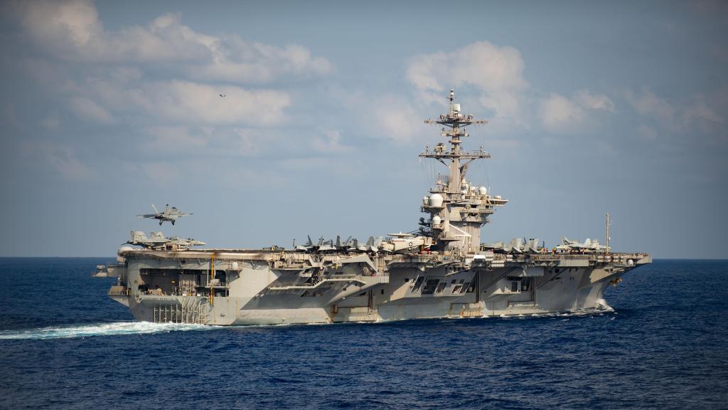 In the Pacific, a COVID-19 outbreak sidelines deployed aircraft carrier Theodore Roosevelt