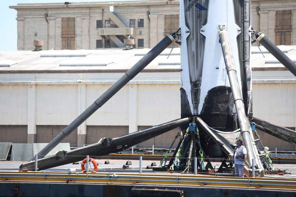 Recovered SpaceX booster arrives aboard drone ship